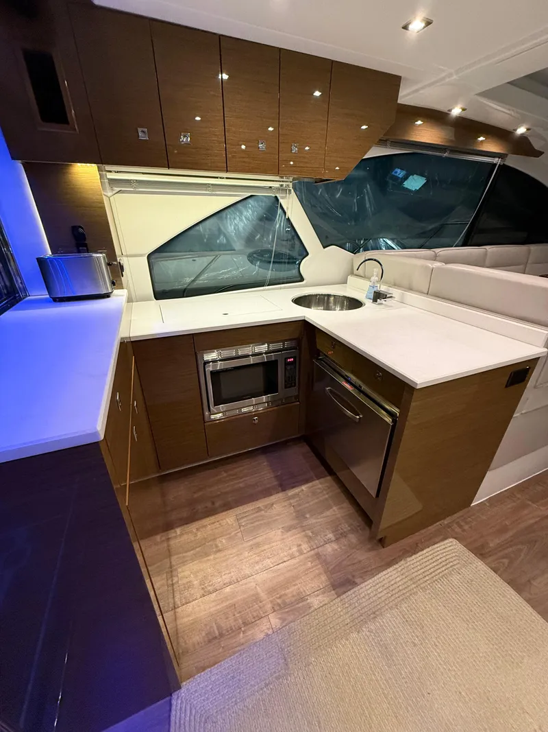 Slide: The Image of Luxurious 2018 Cruisers Yachts 50 Cantius kitchen with modern appliances and sleek design. - 12
