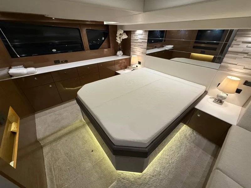 Slide: The Image of Luxurious bedroom interior of 2018 Cruisers Yachts 50 Cantius with modern design and ambient lighting. - 19