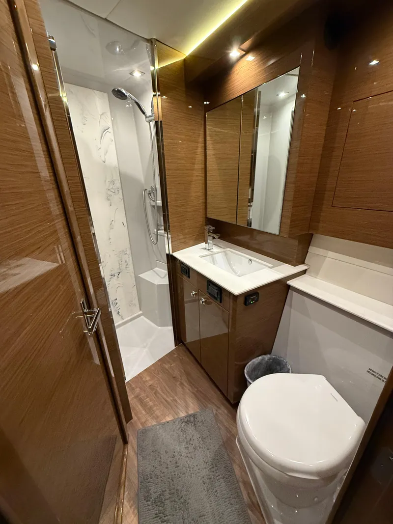 Slide: The Image of Luxurious bathroom in 2018 Cruisers Yachts 50 Cantius with modern fixtures and wood accents. - 20