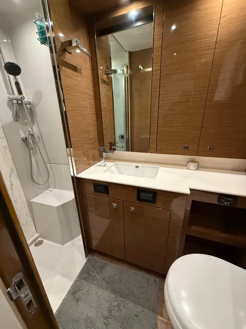 Slide: The Image of Luxurious bathroom in 2018 Cruisers Yachts 50 Cantius with modern fixtures and wood accents. - 21