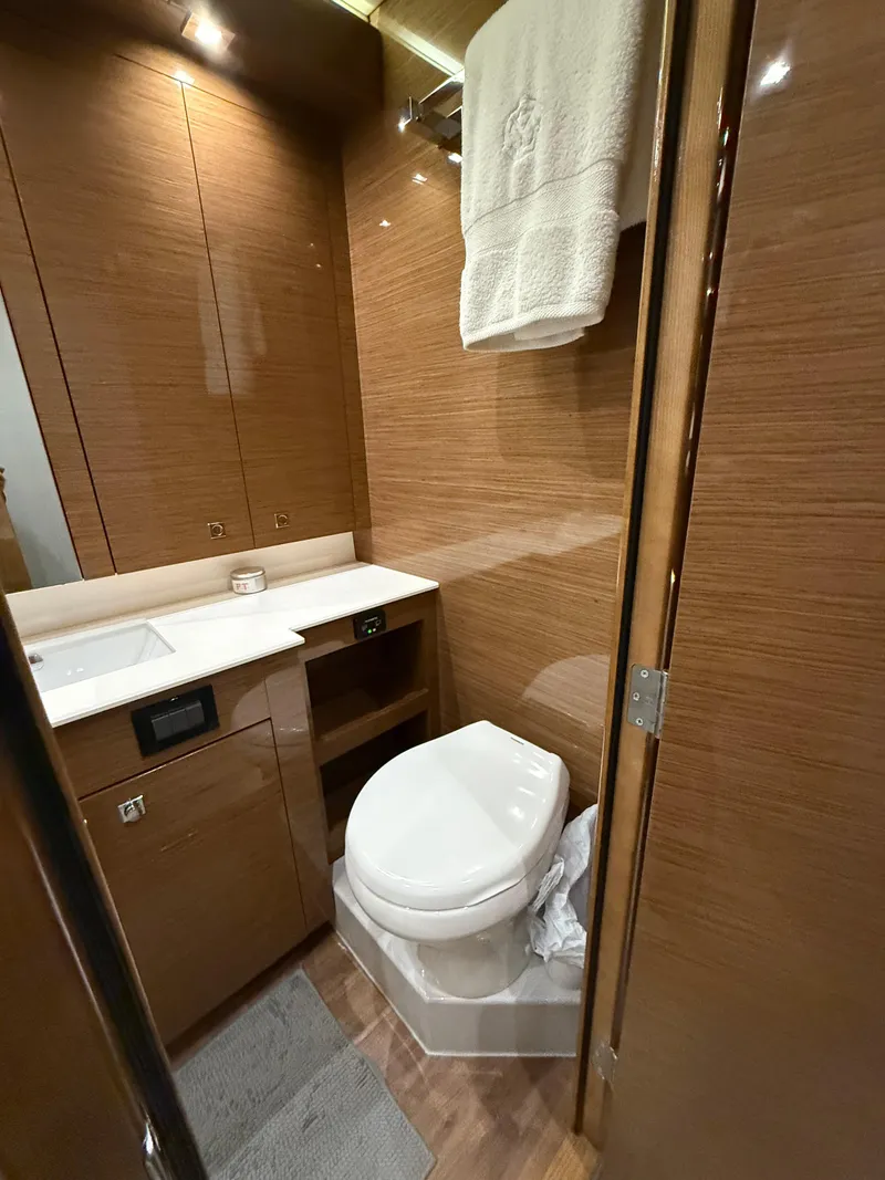 Slide: The Image of Luxurious 2018 Cruisers Yachts 50 Cantius bathroom with modern wood finish and amenities. - 22