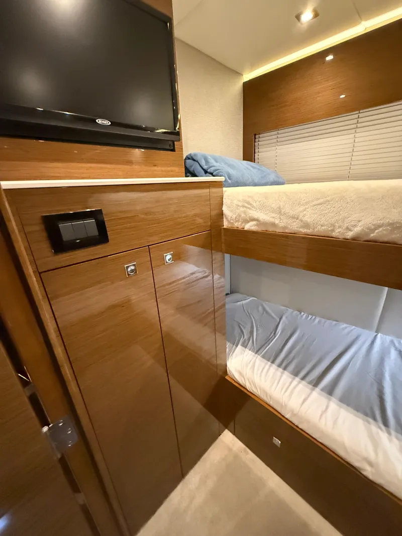 Slide: The Image of 2018 Cruisers Yachts 50 Cantius cabin with bunk beds and TV. - 24