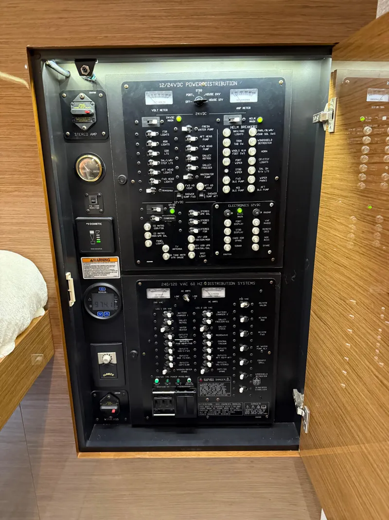 Slide: The Image of Electrical panel inside 2018 Cruisers Yachts 50 Cantius, showcasing power distribution controls. - 25