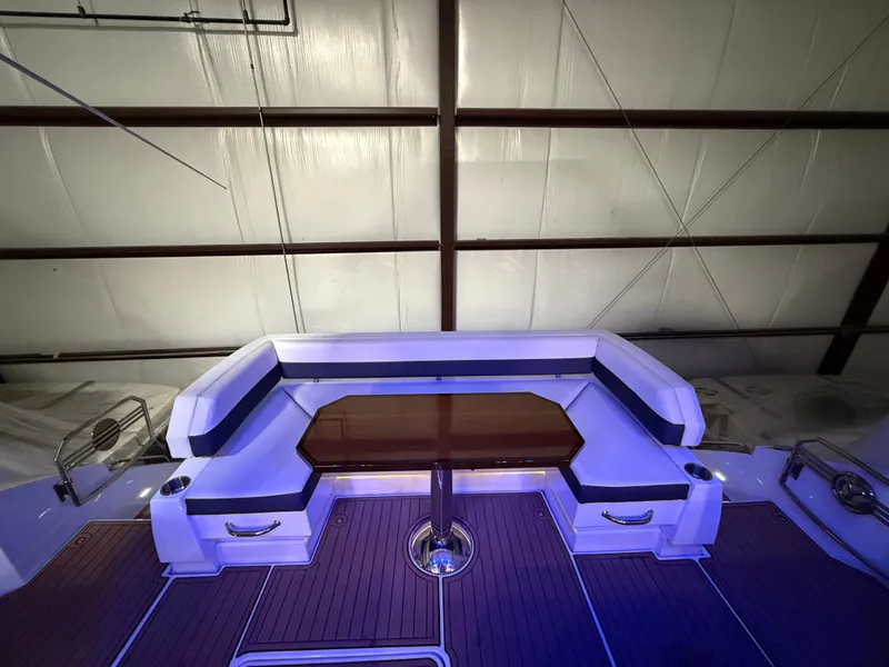 Slide: The Image of 2018 Cruisers Yachts 50 Cantius interior with elegant seating and wooden table. - 3