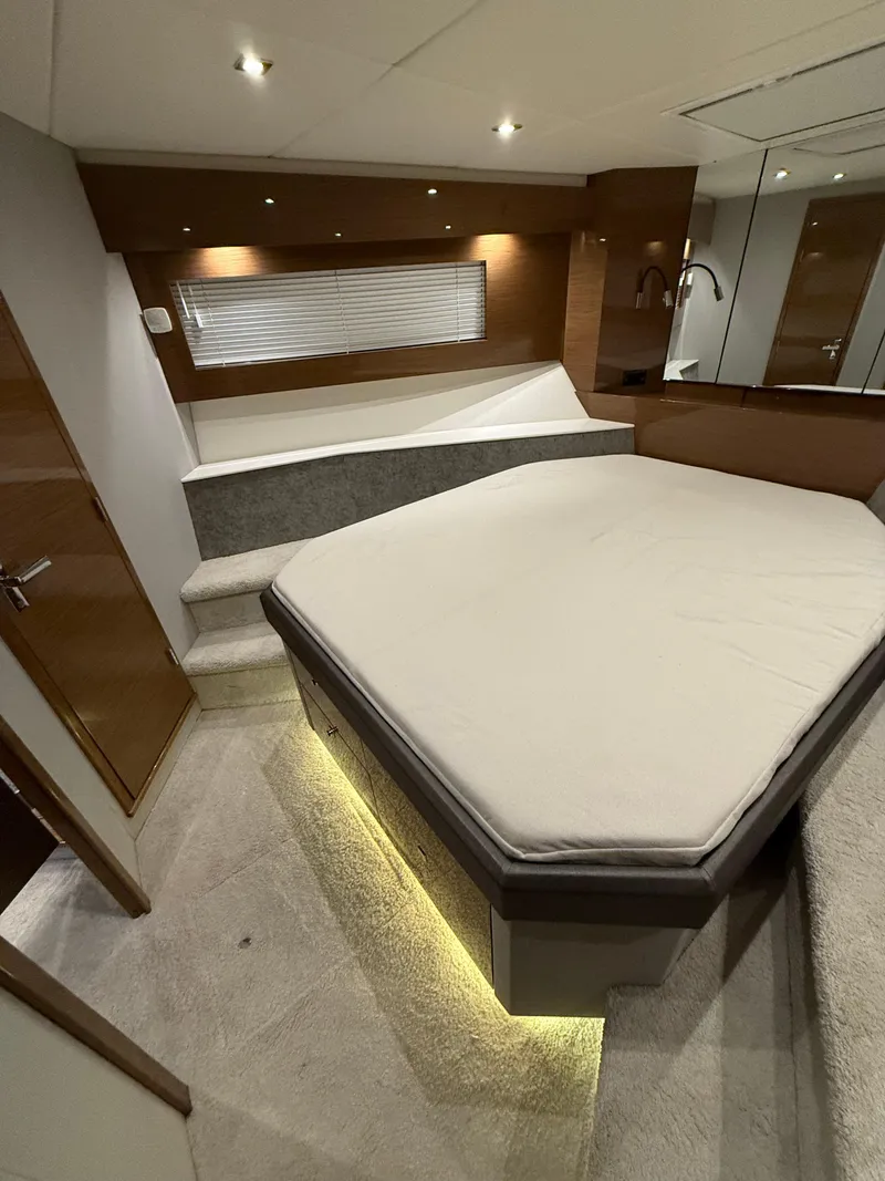 Slide: The Image of Luxurious interior of 2018 Cruisers Yachts 50 Cantius with modern bed and ambient lighting. - 4