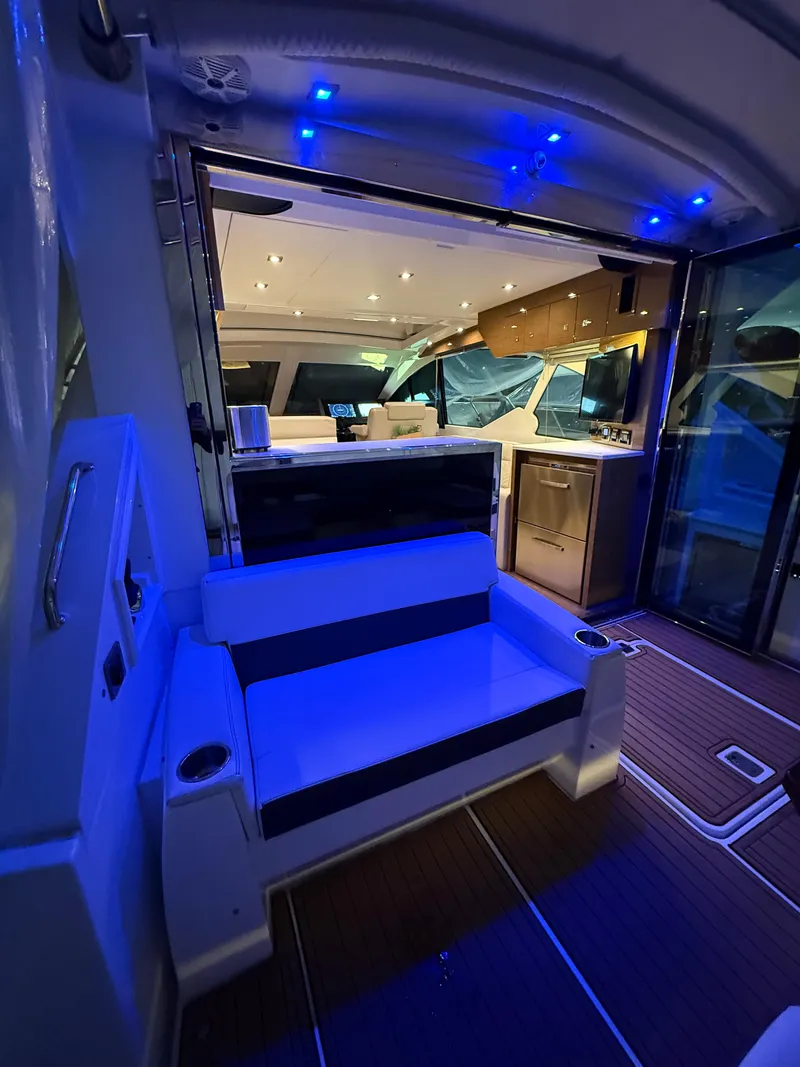 Slide: The Image of Interior of 2018 Cruisers Yachts 50 Cantius with blue ambient lighting. - 6