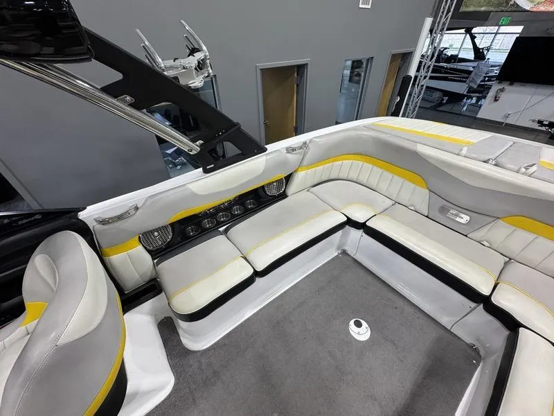 Slide: The Image of 2013 Malibu Wakesetter 24 MXZ interior with gray and yellow seating. - 13