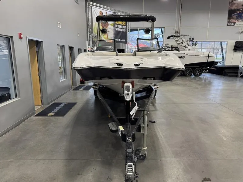 Slide: The Image of 2013 Malibu Wakesetter 24 MXZ boat in showroom, front view. - 5