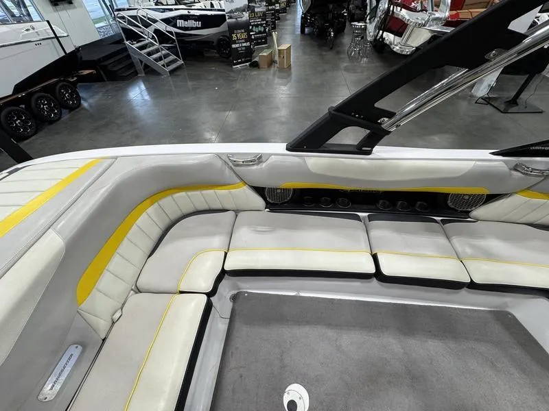 Slide: The Image of 2013 Malibu Wakesetter 24 MXZ interior with spacious seating and modern design. - 6