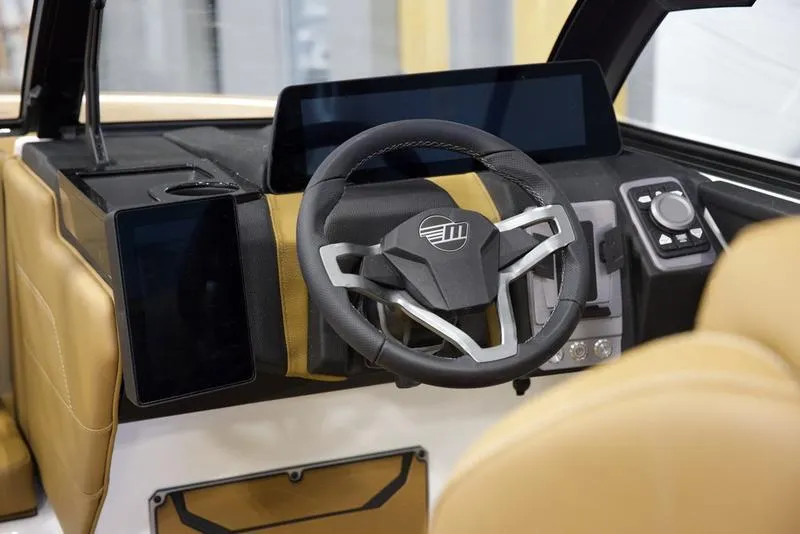 Slide: The Image of 2025 Malibu 23 LSV dashboard with modern steering wheel and digital displays. - 12