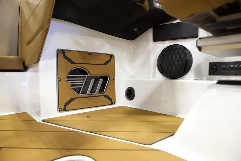 Slide: The Image of 2025 Malibu 23 LSV interior with tan and white design, featuring speaker and stylish panel. - 13