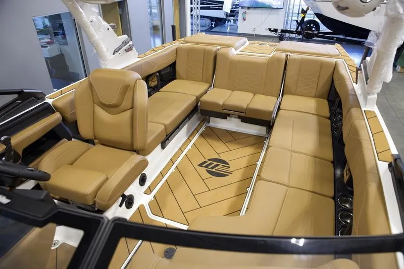 Slide: The Image of Luxurious interior of 2025 Malibu 23 LSV boat with tan leather seating. - 25