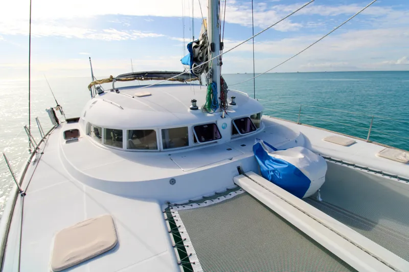 Slide: The Image of Lagoon 410 catamaran sailing on calm ocean waters, 2002 model. - 1