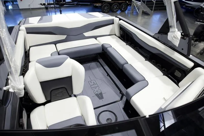 Slide: The Image of 2025 Axis T220 boat interior with white and gray seating, modern design. - 17