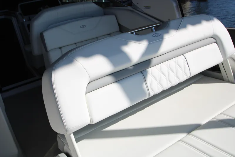 Slide: The Image of 2022 Regal 28 Express boat interior with white leather seating. - 13