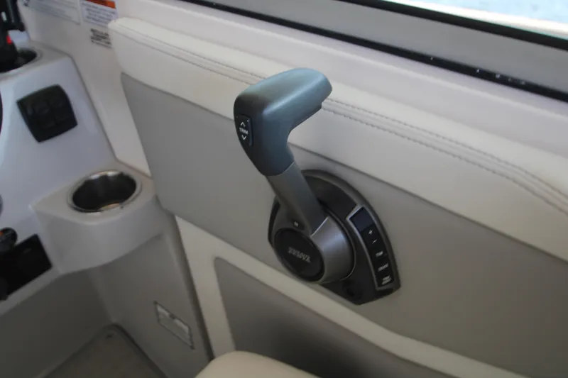 Slide: The Image of Throttle control in 2022 Regal 28 Express boat interior. - 19