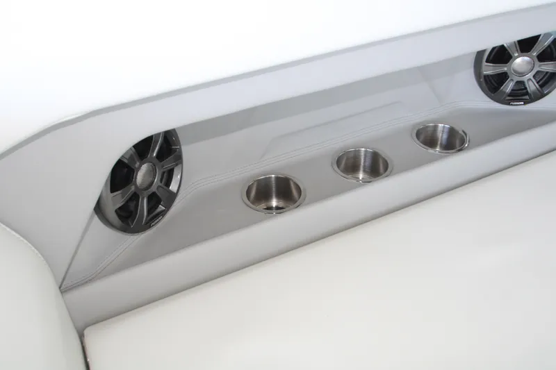 Slide: The Image of 2022 Regal 28 Express boat interior with speakers and cup holders. - 22