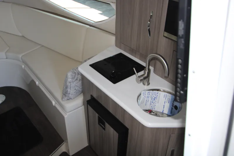 Slide: The Image of 2022 Regal 28 Express interior with kitchenette and seating area. - 29