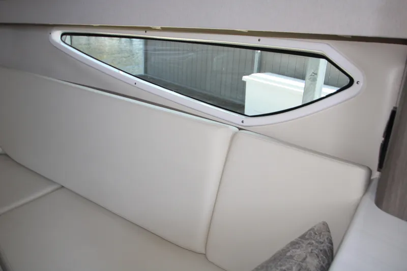 Slide: The Image of Interior of 2022 Regal 28 Express boat with sleek window design. - 32