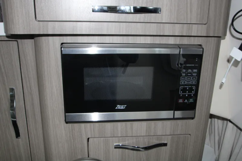 Slide: The Image of Microwave in 2022 Regal 28 Express boat kitchen interior. - 37