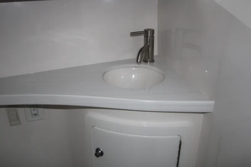 Slide: The Image of Compact bathroom sink in 2022 Regal 28 Express boat. - 41