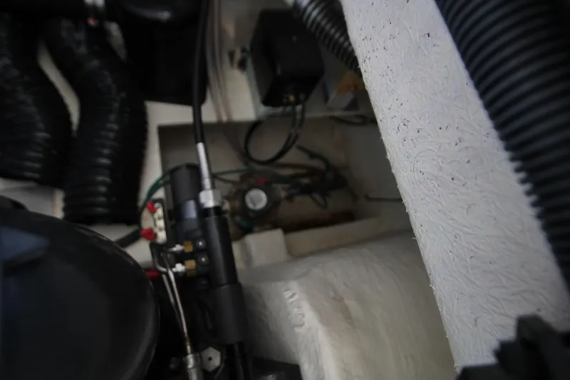 Slide: The Image of Engine compartment of 2022 Regal 28 Express boat, showing mechanical components and wiring. - 42