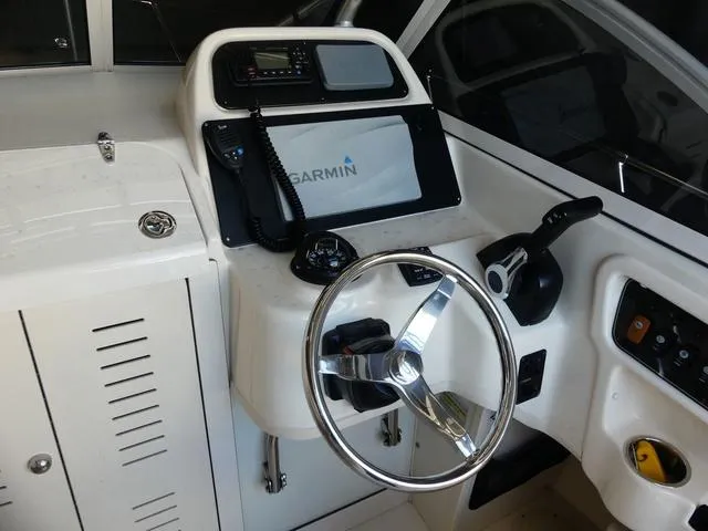 Slide: The Image of 2022 Grady-White Adventure 208 boat helm with Garmin navigation system. - 12