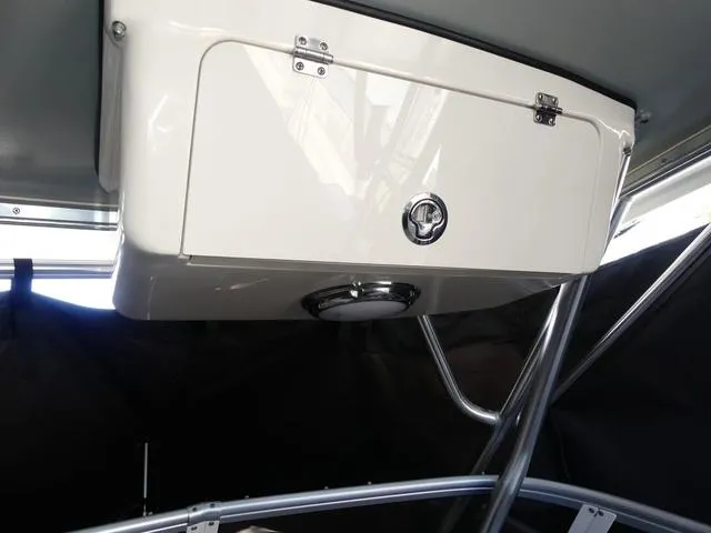 Slide: The Image of Overhead storage compartment in 2022 Grady-White Adventure 208 boat interior. - 18