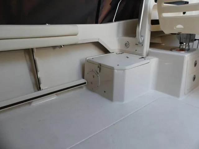 Slide: The Image of 2022 Grady-White Adventure 208 boat interior with seating and storage. - 22