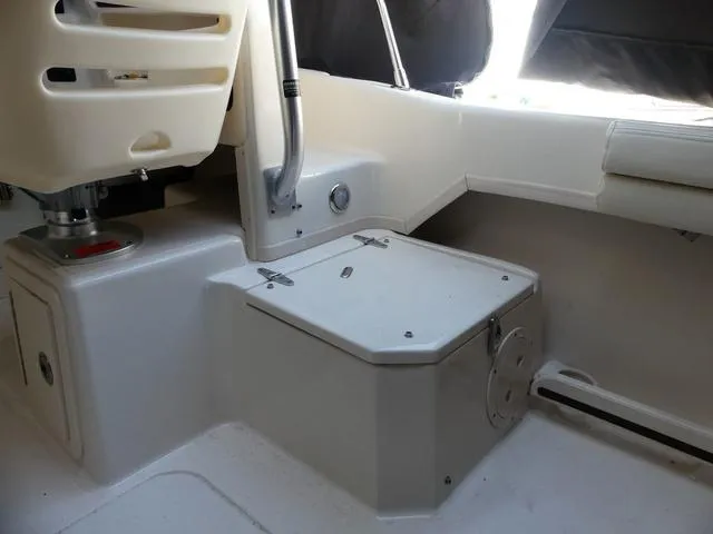 Slide: The Image of Interior of 2022 Grady-White Adventure 208 boat, featuring seating and storage area. - 23