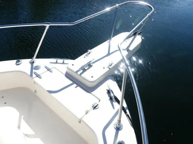 Slide: The Image of 2022 Grady-White Adventure 208 boat bow with stainless steel railings on calm water. - 25
