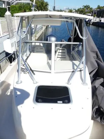 Slide: The Image of 2022 Grady-White Adventure 208 boat docked by a canal. - 27