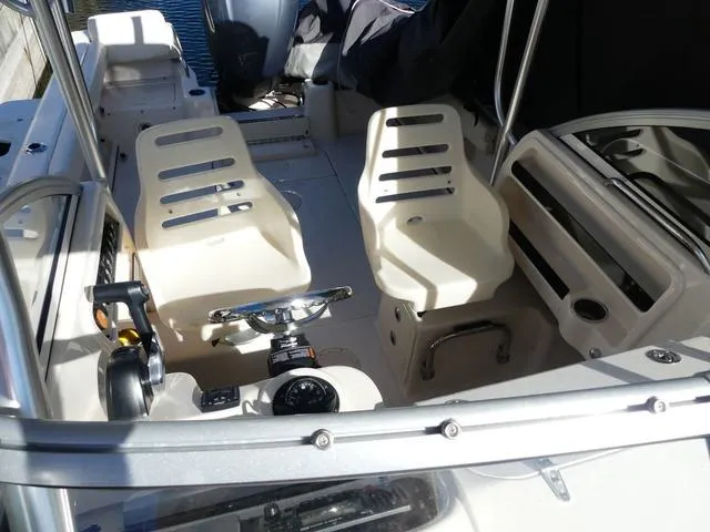 Slide: The Image of 2022 Grady-White Adventure 208 boat interior with helm and seating. - 29
