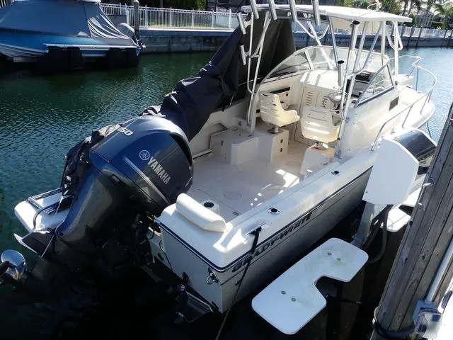 Slide: The Image of 2022 Grady-White Adventure 208 boat with Yamaha engine docked in marina. - 4