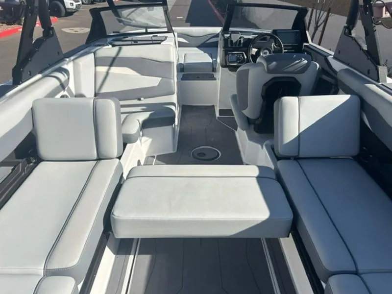 Slide: The Image of 2023 Axis T235 boat interior with spacious seating and modern dashboard. - 17