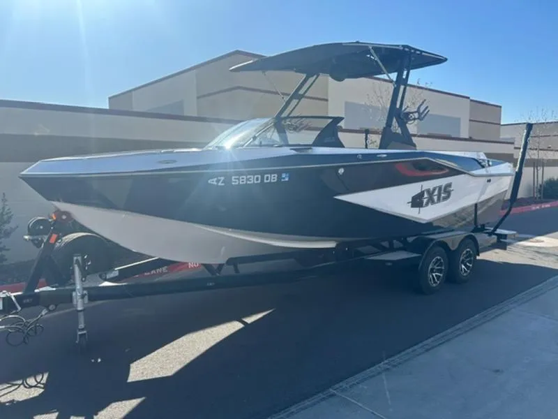 Slide: The Image of 2023 Axis T235 boat on trailer, parked outdoors in sunlight. - 3