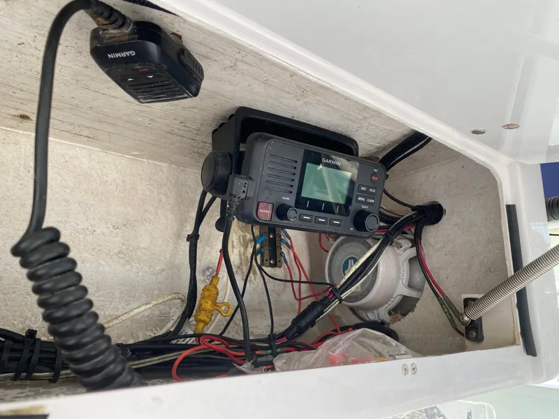 Slide: The Image of Boat electronics compartment with Garmin radio, wiring in 2000 Donzi 35 ZF Open. - 21