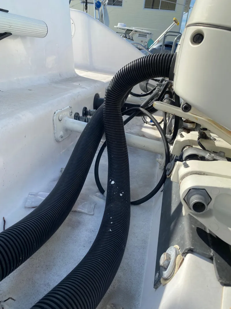 Slide: The Image of Close-up of 2000 Donzi 35 ZF Open boat wiring and hoses. - 26