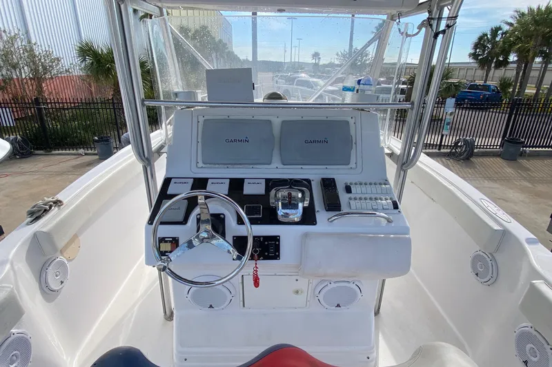 Slide: The Image of 2000 Donzi 35 ZF Open boat cockpit with steering wheel and Garmin navigation system. - 29
