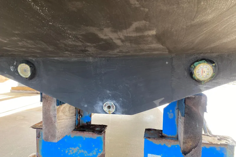 Slide: The Image of Bottom view of a 2000 Donzi 35 ZF Open boat on a stand. - 31