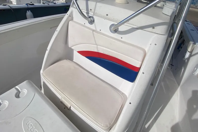 Slide: The Image of 2000 Donzi 35 ZF Open boat seat with red and blue accents. - 32