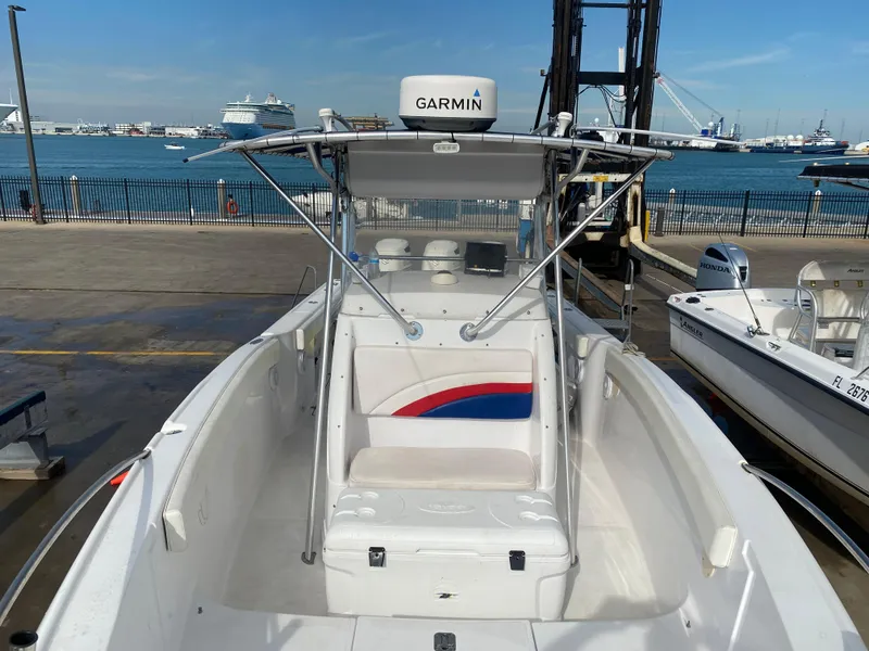 Slide: The Image of 2000 Donzi 35 ZF Open boat with Garmin equipment, docked by the waterfront. - 6