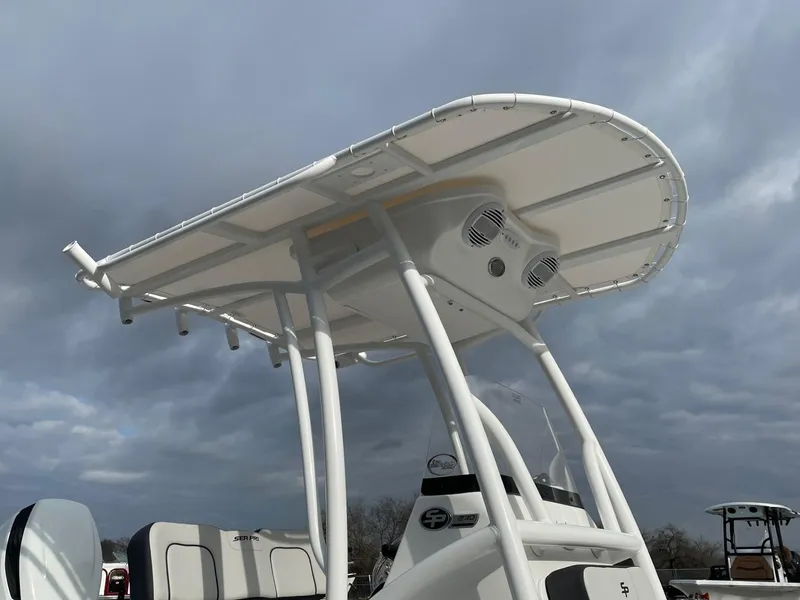 Slide: The Image of Seapro 230 boat, 2025 model, featuring a sleek T-top design against a cloudy sky. - 4