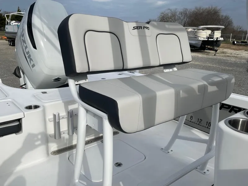 Slide: The Image of Seapro 230 boat seat, 2025 model, with Suzuki engine in background. - 5