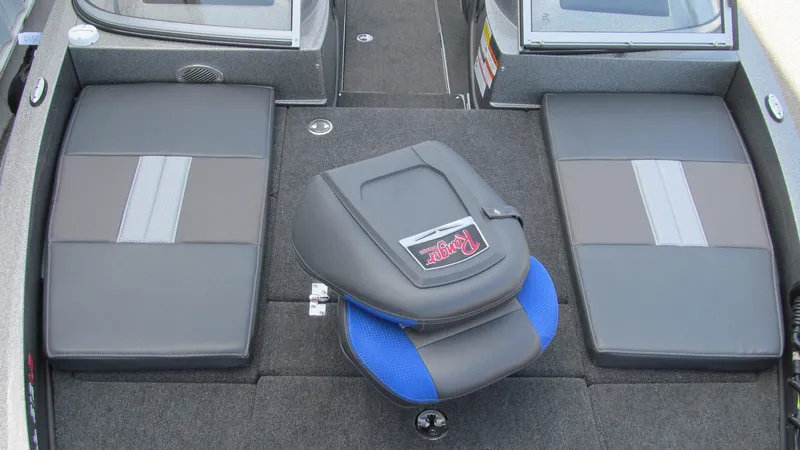 Slide: The Image of 2025 Ranger 212LS boat interior with cushioned seating and sleek design. - 11