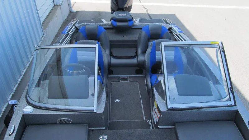Slide: The Image of 2025 Ranger 212LS boat interior with blue and black seating, dual windshields. - 12