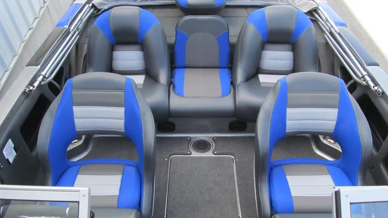 Slide: The Image of 2025 Ranger 212LS boat interior with blue and gray seating arrangement. - 14