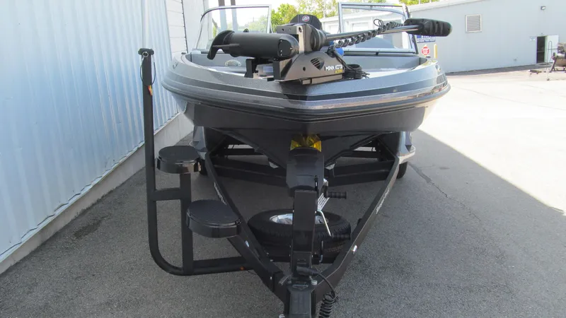 Slide: The Image of 2025 Ranger 212LS boat on trailer, front view, parked outdoors. - 15