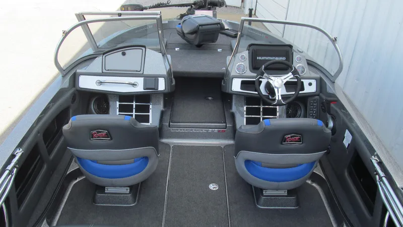 Slide: The Image of 2025 Ranger 212LS boat interior with dual seats and modern dashboard. - 5