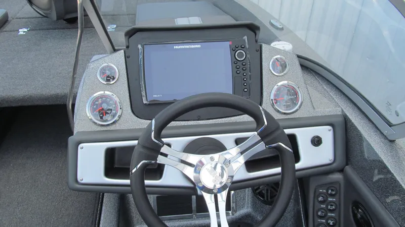 Slide: The Image of Dashboard of 2025 Ranger 212LS boat with steering wheel and electronic display. - 7